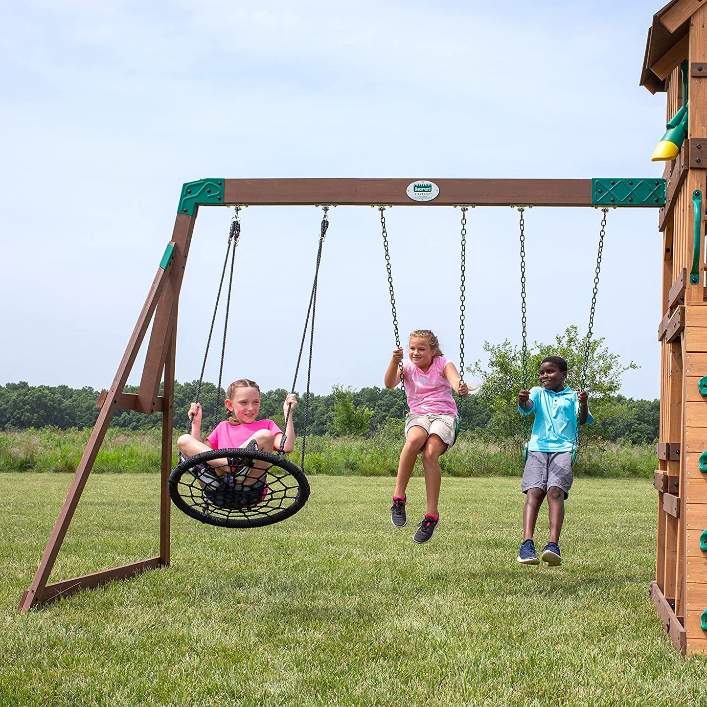 Highlander All Cedar Wooden Swing Set, 3 Levels, Step Ladder, Snack Bar with Bench, Sandbox, 2 Belt Swings, Web Swing, 10Ft Wave Slide, Rock Wall,